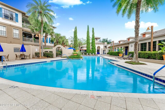 view of swimming pool with a patio