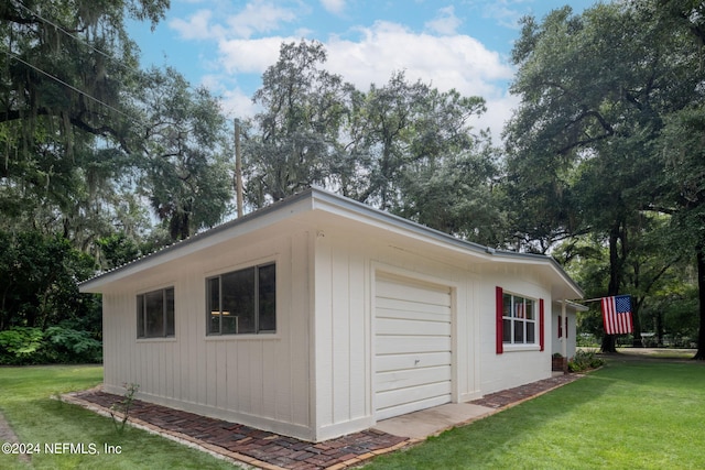 garage featuring a yard