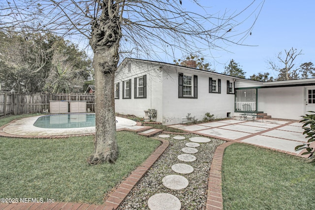 exterior space featuring a fenced in pool, a patio area, and fence