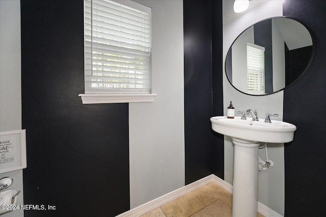 bathroom with tile patterned floors