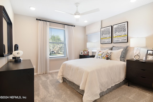 bedroom featuring ceiling fan and light colored carpet