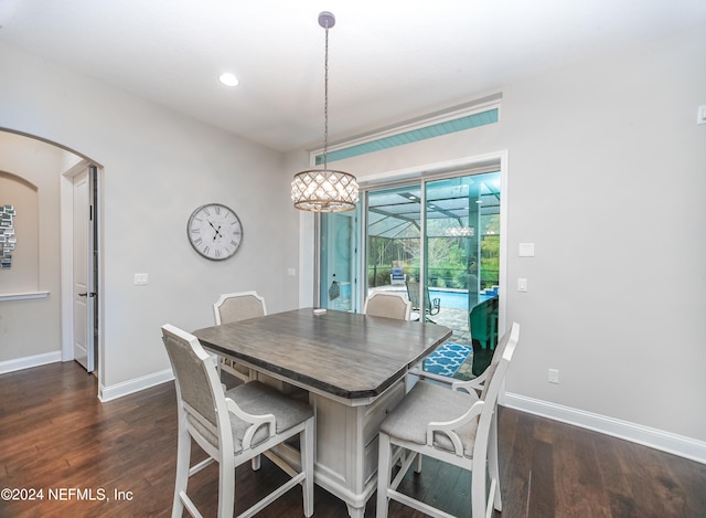 dining space featuring dark wood-type flooring