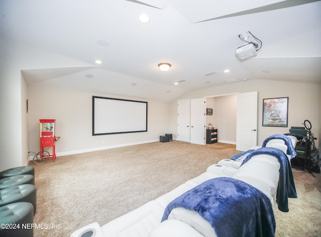 cinema room with carpet and lofted ceiling