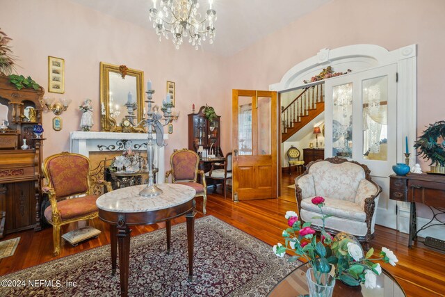 living room with a chandelier and hardwood / wood-style flooring