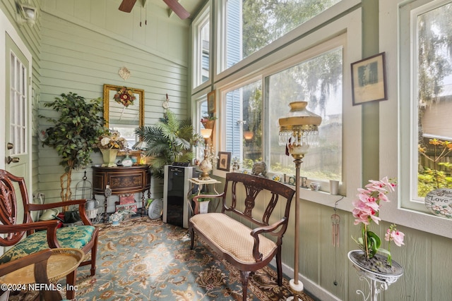 sunroom / solarium featuring a wealth of natural light and ceiling fan