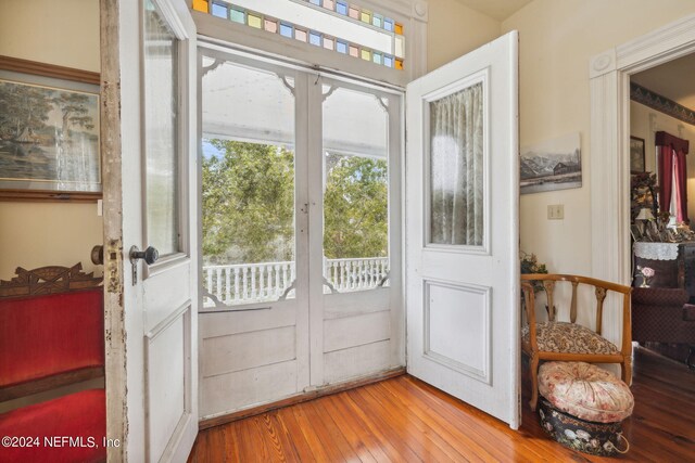 doorway featuring french doors and hardwood / wood-style floors