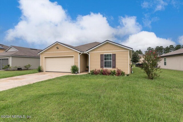 ranch-style house with a front yard and a garage