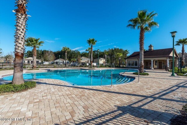 view of swimming pool featuring a patio