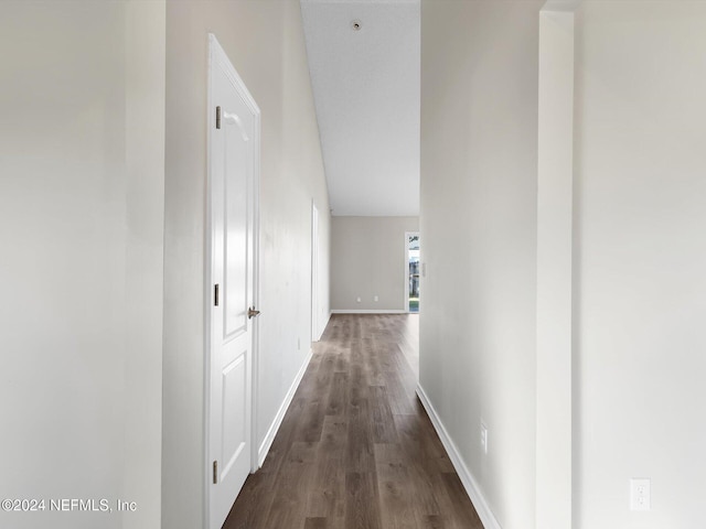 corridor with dark hardwood / wood-style floors