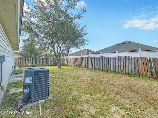 view of yard featuring central AC