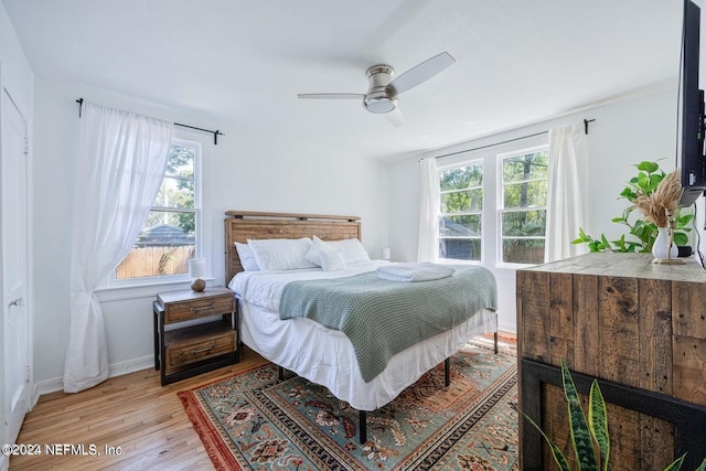 bedroom featuring light wood-type flooring and ceiling fan