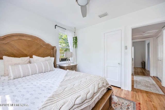 bedroom featuring wood-type flooring and ceiling fan