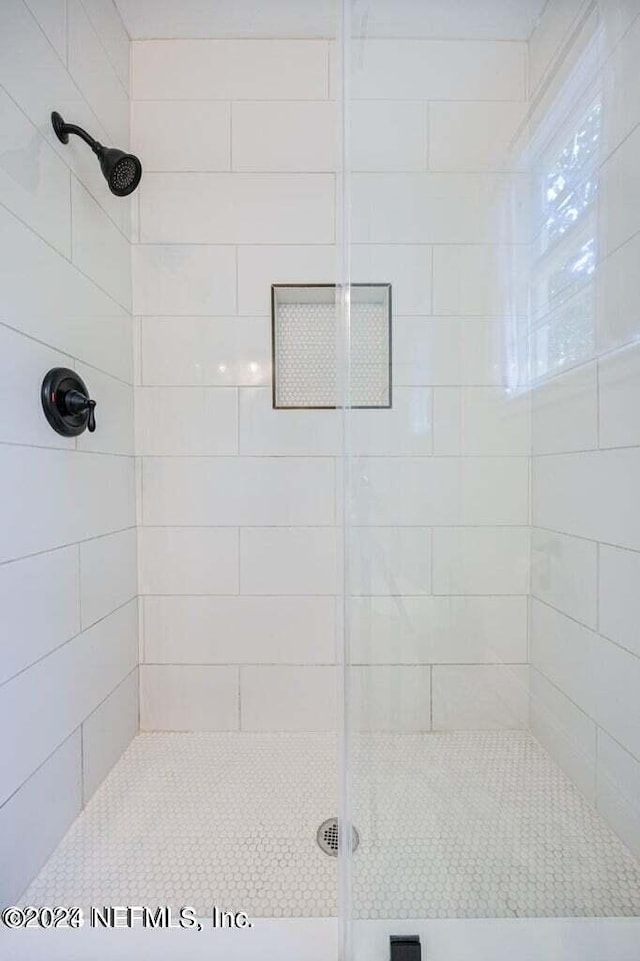 bathroom with an enclosed shower