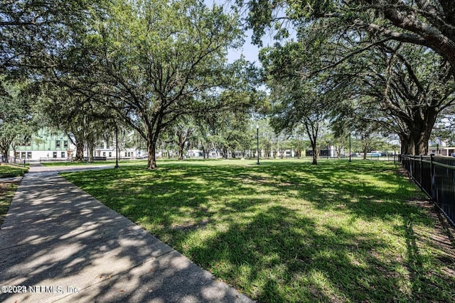 view of home's community with a lawn