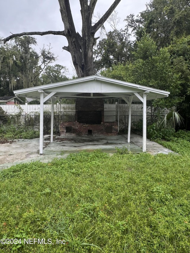 view of vehicle parking featuring a lawn