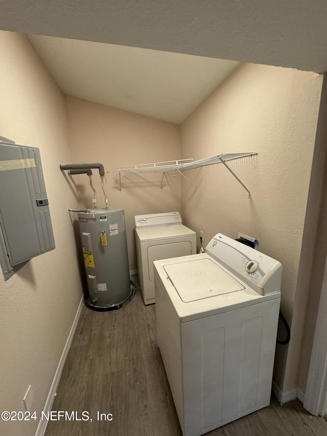 washroom with electric water heater, electric panel, dark wood-type flooring, and washer and dryer