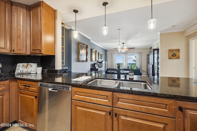 kitchen with dishwasher, sink, hanging light fixtures, crown molding, and decorative backsplash