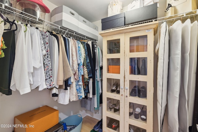 spacious closet featuring hardwood / wood-style floors