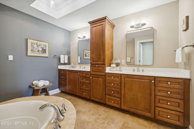 bathroom featuring tile patterned floors, vanity, and a bathing tub