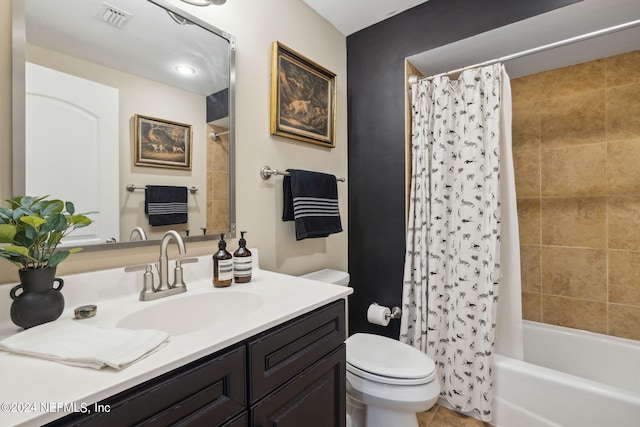 full bathroom featuring tile patterned floors, vanity, toilet, and shower / tub combo with curtain