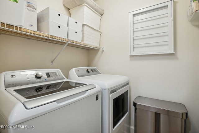 washroom with separate washer and dryer