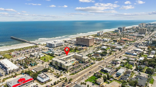 aerial view featuring a water view and a view of the beach