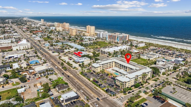 bird's eye view with a beach view and a water view