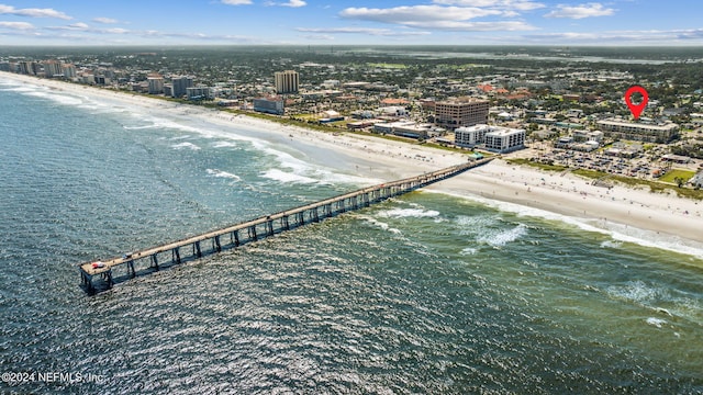 bird's eye view featuring a view of the beach and a water view