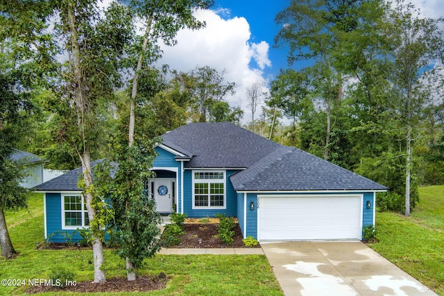 view of front facade featuring a garage and a front lawn