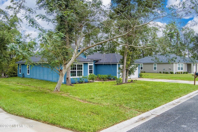 view of front of home with a front lawn