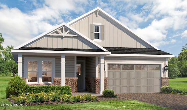 craftsman-style home with a garage and a front lawn