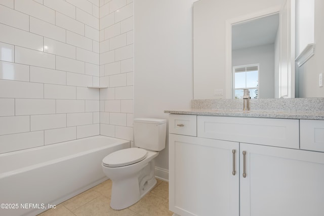 full bathroom with tile patterned floors, vanity, toilet, and tiled shower / bath