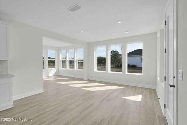 unfurnished living room with light hardwood / wood-style floors