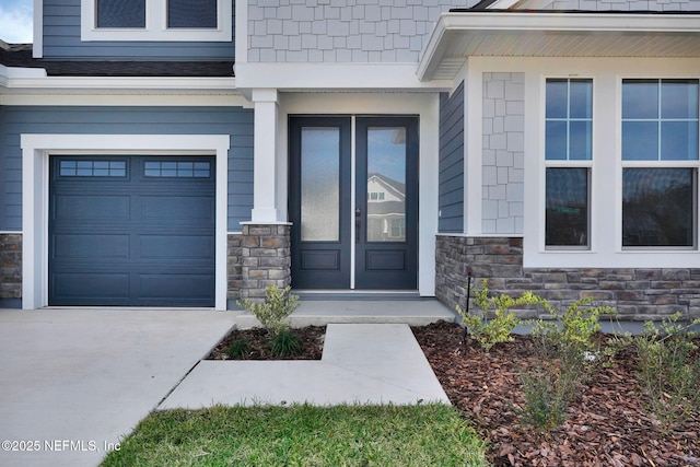 view of exterior entry with a garage