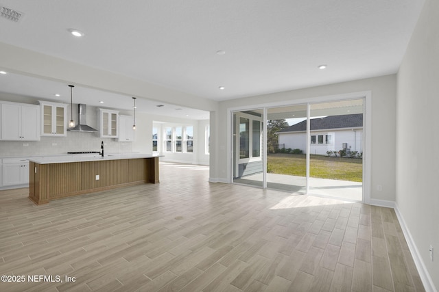 unfurnished living room featuring light hardwood / wood-style flooring