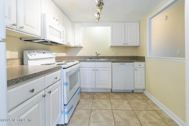 kitchen featuring white cabinets, white appliances, and sink