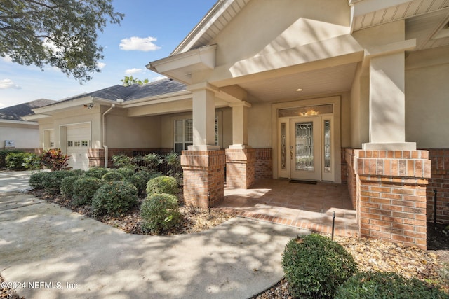 doorway to property featuring a garage