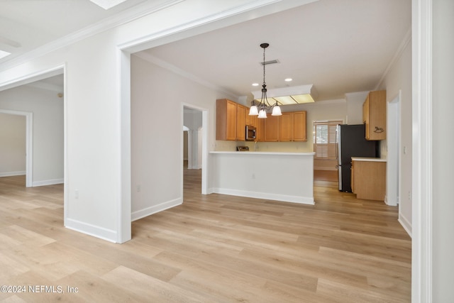 kitchen with a notable chandelier, light hardwood / wood-style flooring, and hanging light fixtures