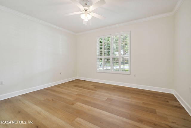 empty room featuring ornamental molding, ceiling fan, and hardwood / wood-style flooring