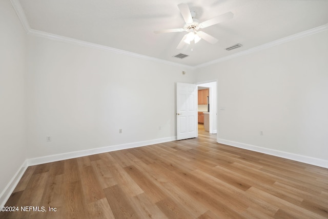 empty room with light wood-type flooring, ornamental molding, and ceiling fan