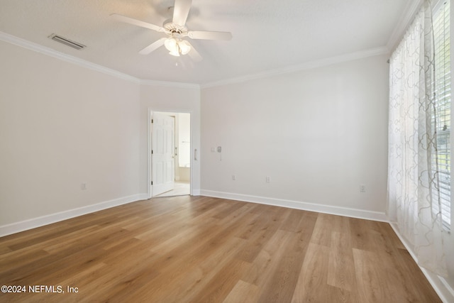 unfurnished room featuring light hardwood / wood-style flooring, ceiling fan, and ornamental molding