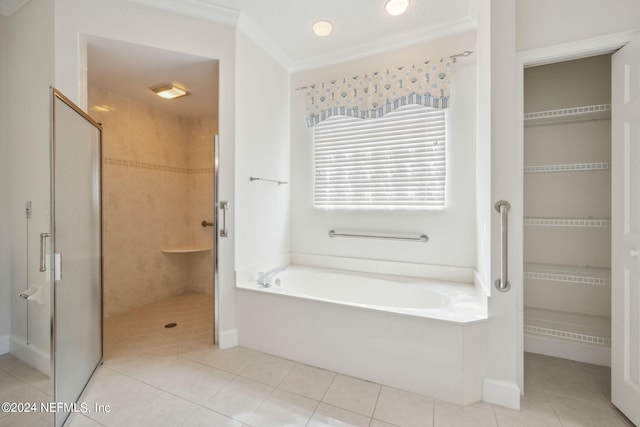 bathroom with plus walk in shower, crown molding, and tile patterned floors