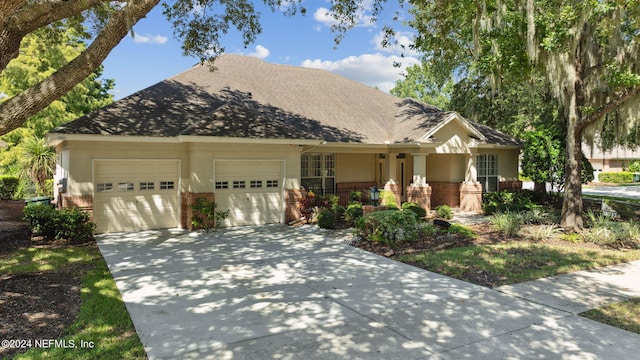 view of front of home featuring covered porch and a garage