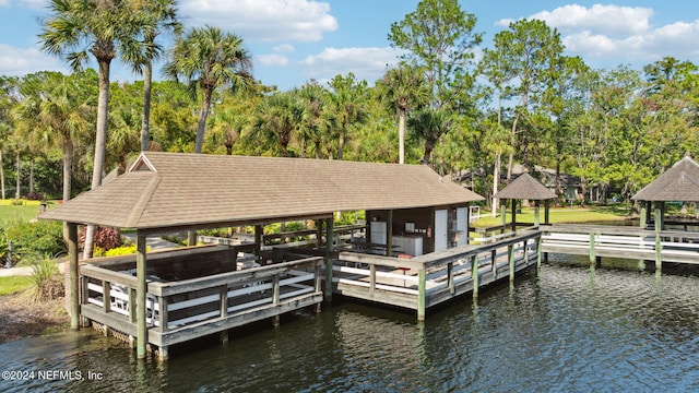 view of dock with a gazebo and a water view