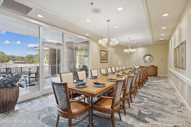 dining area featuring an inviting chandelier