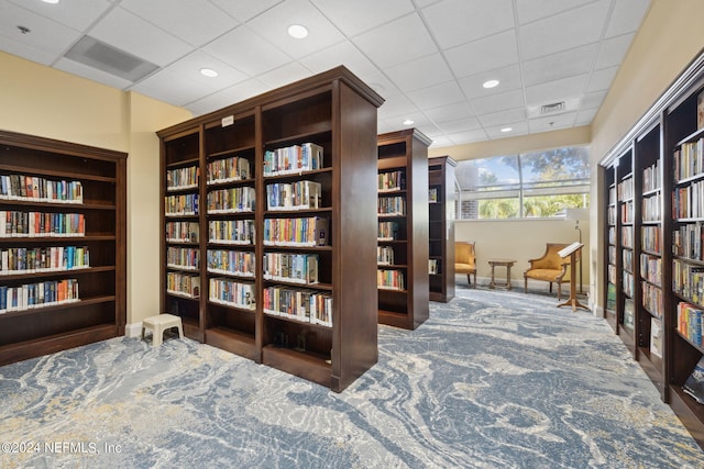 sitting room featuring a paneled ceiling