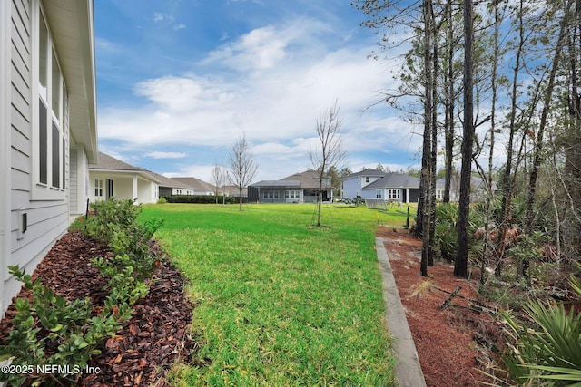 view of yard featuring a residential view