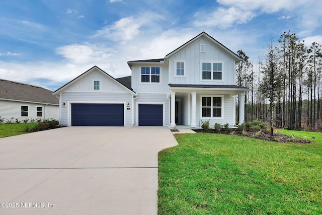 modern farmhouse featuring an attached garage, driveway, board and batten siding, and a front yard