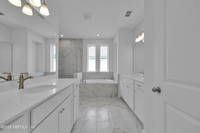 full bath with marble finish floor, visible vents, a sink, and a bath