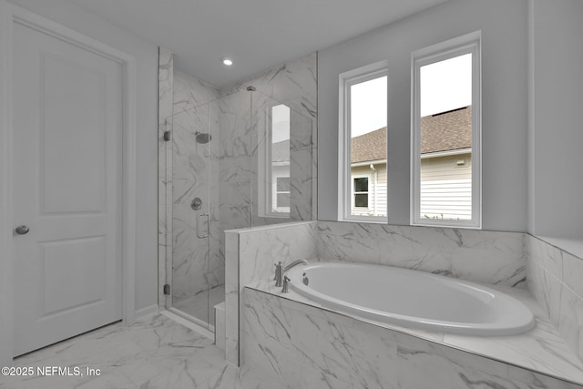 bathroom featuring marble finish floor, a marble finish shower, a bath, and recessed lighting